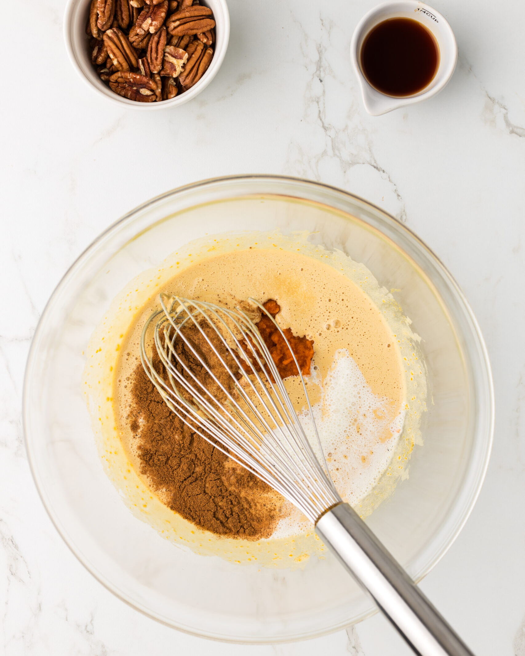 Stir in cream, pumpkin puree, spice seasoning, vanilla bean, and salt.